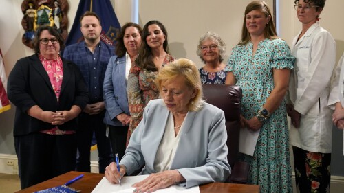 Maine Gov. Janet Mills signs a bill to expand access to abortions later in pregnancy, Wednesday, July 19, 2023, at the statehouse in Augusta, Maine.  (AP Photo/Robert F. Bukaty)