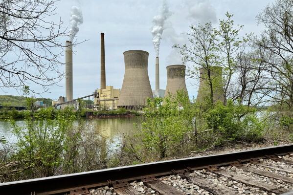 American Electric Power's John Amos coal-fired plant in Winfield, W.Va, is seen from the town of Poca across the Kanawha River, Tuesday, April 22, 2025. (AP Photo/John Raby)