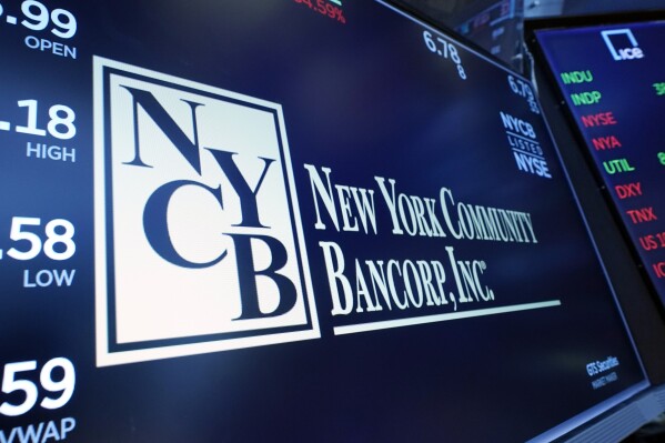 FILE - On January 31, 2024, the New York Community Bancorp logo is displayed above the trading post at the New York Stock Exchange. New York Community Bancorp's stock price fell even more sharply on Wednesday, March 6, 2024, dropping below $2. This has decreased by more than 80% over the past year.  (AP Photo/Richard Drew, File)