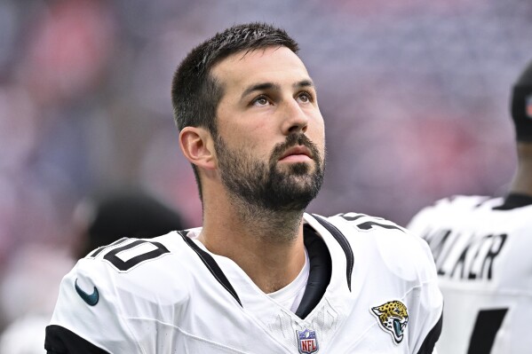 FILE - Jacksonville Jaguars placekicker Brandon McManus stands on the sideline during an NFL football game against the Houston Texans, Nov. 26, 2023, in Houston. The Washington Commanders say they were made aware Monday, May 27, 2024, of a lawsuit filed in civil court against McManus last week. A spokesperson says the team is looking into the matter and has spoken with McManus' agent and the NFL office. ESPN reported two women are suing McManus for sexually assaulting them during a charter flight to London last year when he was playing for the Jaguars. (AP Photo/Maria Lysaker, File)