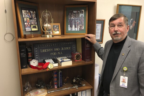 FILE - Oregon Sen. Brian Boquist poses in his office inside the state Capitol in Salem, Ore., July 3, 2019. Republican state Sens. Boquist and Dennis Linthicum are seeking statewide office after being barred from reelection for staging a record-long walkout in 2023 to stall bills on abortion, transgender health care and gun rights. Boquist, who also made national headlines at the start of a GOP-led walkout in 2019 for threatening comments toward state police, is running for state treasurer. (AP Photo/Andrew Selsky, File)