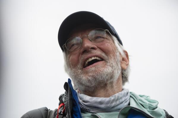 American climber Arthur Muir, 75, gestures as he arrives in Kathmandu, Nepal, Sunday, May 30, 2021. The retired attorney from Chicago who became the oldest American to scale Mount Everest, and a Hong Kong teacher who is now the fastest female climber of the world's highest peak, on Sunday returned safely from the mountain where climbing teams have been struggling with bad weather and a coronavirus outbreak. Arthur Muir, 75, scaled the peak earlier this month, beating the record by another American, Bill Burke, at age 67.  (AP Photo/Bikram Rai)