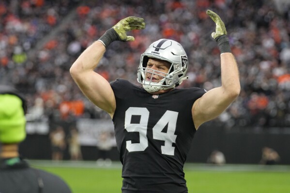 FILE - Las Vegas Raiders defensive end Carl Nassib (94) is seen on the sideline during the first half of an NFL football game against the Denver Broncos, Sunday, Dec. 26, 2021, in Las Vegas. Edge rusher Carl Nassib, the NFL’s first openly gay player to play in a regular-season game, announced his retirement on Wednesday, Sept. 6, 2023. Nassib came out in 2021 while with the Raiders. He spent last season with the Tampa Bay Buccaneers. (AP Photo/Jeff Bottari, File)