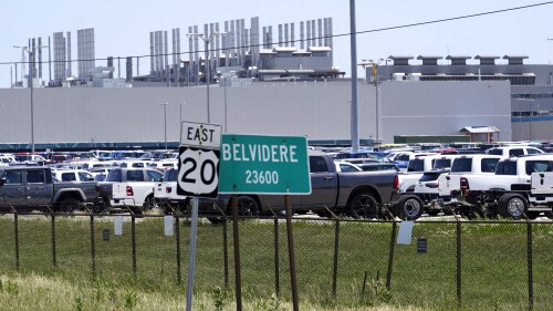 New vehicles sit in a parking lot waiting for transport at the former Fiat Chrysler Auto Plant, now owned by Stellantis, Monday, July 10, 2023, in Belvidere. Ill. Contract talks begin this week between the United Auto Workers and automakers. UAW President Shawn Fain wants to halt any plant closings in the wake of Stellantis' plan to shutter the factory in Belvidere, (AP Photo/Charles Rex Arbogast)