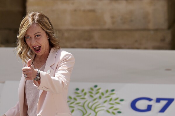 Italian Premier Giorgia Meloni gives the thumbs up as she welcomes leaders during a G7 world leaders summit at Borgo Egnazia, southern Italy, Thursday, June 13, 2024. (Christopher Furlong/Pool Photo via AP)