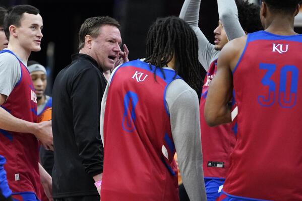 Kansas head coach Bill Self, second from left, talks with players during a practice for the NCAA men's college basketball tournament Thursday, March 24, 2022, in Chicago. Kansas faces Providence in a Sweet 16 games on Friday. (AP Photo/Nam Y. Huh)
