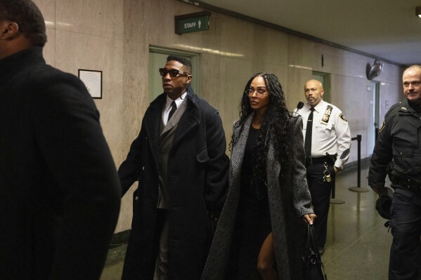 Actors Jonathan Majors, left, and Meagan Good arrive at court for a jury selection on Major's domestic violence case, Wednesday, Nov. 29, 2023, in New York. (AP Photo/Yuki Iwamura)
