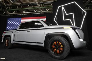 FILE - In this Thursday, June 25, 2021, file photo, the electric Endurance pick-up truck is on display at Lordstown Motors Corporation, in Lordstown, Ohio. Startup commercial electric vehicle maker Lordstown Motors says it may not be in business a year from now as it tries to secure funding to start full production of an electric pickup truck. In a quarterly regulatory filing released Tuesday, June 8, 2021, Lordstown says the $587 million it had on hand as of March 31 isn’t enough to start commercial production and begin selling the truck. (AP Photo/Tony Dejak, File)