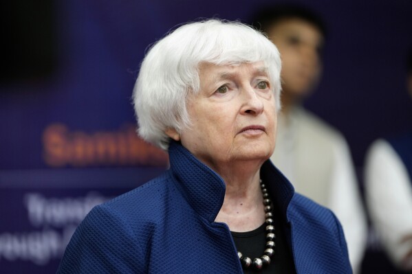 FILE - United States Treasury Secretary Janet Yellen watches a presentation during her visit to a School of Excellence facility in Gandhinagar, India, Sunday, July 16, 2023. The Biden administration plans to increase scrutiny of investment plans of foreign-owned companies operating in the United States, with Treasury Secretary Janet Yellen saying Thursday, Sept. 14, that national security is a “foremost priority.” (AP Photo/Ajit Solanki, File)