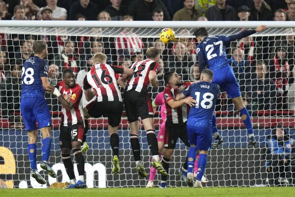 West Ham's Nayef Aguerd, right, makes an attempt to score during the English Premier League soccer match between Brentford and West Ham United at the Brentford Community Stadium, in London, England, Saturday, Nov. 4, 2023. (AP Photo/Alastair Grant)