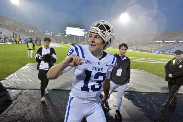 Duke quarterback Riley Leonard (13) reacts to fans after their victory over UConn in an NCAA college football game, Saturday, Sept. 23, 2023, in Hartford, Conn.(AP Photo/Josh Reynolds)