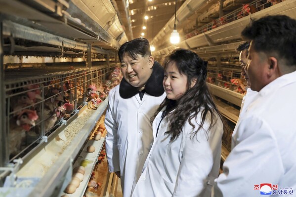 In this photo provided on Monday, Jan. 8, 2024, by the North Korean government, North Korean leader Kim Jong Un, center, with his daughter visits a newly-built chicken farm in Hwangju County of North Hwanghae Province on Jan. 7, 2024. Independent journalists were not given access to cover the event depicted in this image distributed by the North Korean government. The content of this image is as provided and cannot be independently verified. Korean language watermark on image as provided by source reads: 