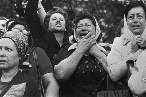 FILE - Members of the Mothers of Plaza de Mayo protest in San Martin Square in Buenos Aires, Argentina, Nov. 21, 1977. Week after week, since April 1977, the mothers of disappeared children have gathered at the square that provided the group with its name, despite being discredited during the dictatorship as “crazy” and “terrorists.” (AP Photo/Eduardo Di Baia, File)