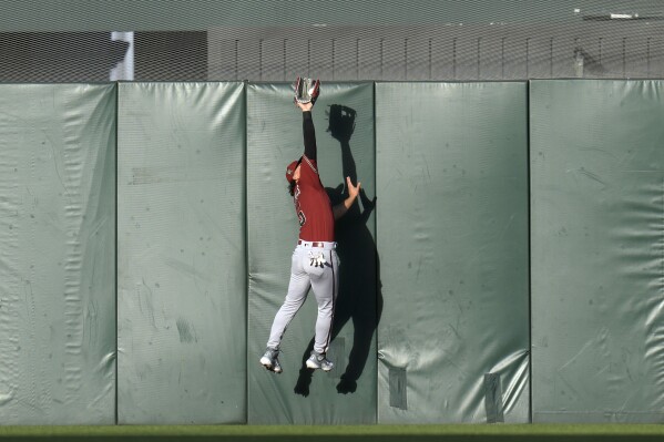 Arizona Diamondbacks center fielder Alek Thomas catches a flyout by San Francisco Giants' Wilmer Flores during the first inning of a baseball game Monday, July 31, 2023, in San Francisco. (AP Photo/Godofredo A. Vásquez)