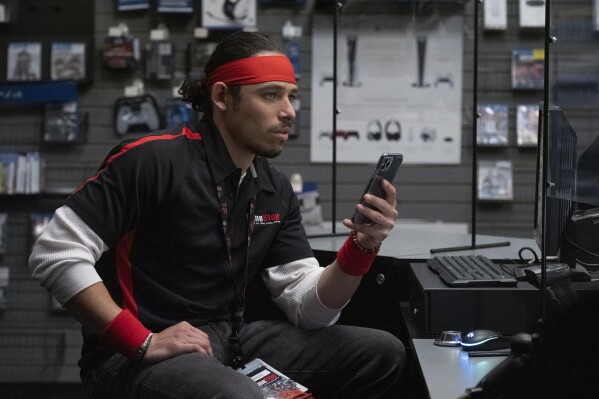 This image released by Sony Pictures shows Anthony Ramos in a scene from "Dumb Money." (Claire Folger/Sony Pictures via AP)