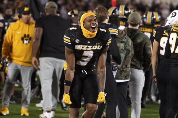 Missouri wide receiver Luther Burden III celebrates on the sidelines during an NCAA college football game against Oklahoma Saturday, Nov. 9, 2024, in Columbia, Mo. Missouri won 30-23. (AP Photo/L.G. Patterson)