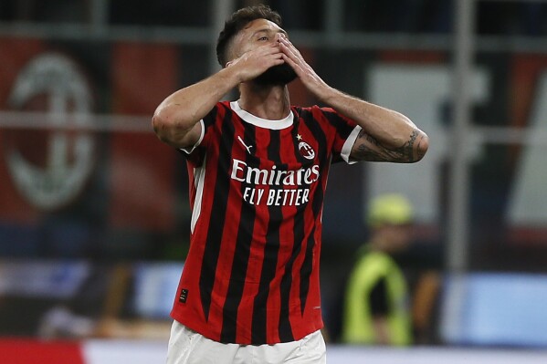 AC Milan's Olivier Giroud celebrates after scoring a goal during the Serie A soccer match against Salernitana at the Giuseppe Meazza Stadium in Milan, Italy, Saturday, May 25, 2024. (Alberto Mariani/LaPresse via AP)