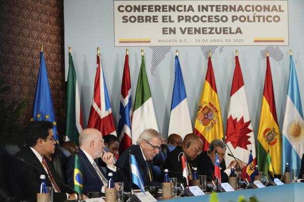 International delegates attend a conference focused on Venezuela's political crisis in Bogota, Colombia, Tuesday, April 25, 2023. Organized by Colombian President Gustavo Petro, the conference is meant to jumpstart official dialogue between the Venezuelan government and its adversaries, as it promotes that the U.S. lifts some sanctions against the President Nicolas Maduro government. (AP Photo/Fernando Vergara)