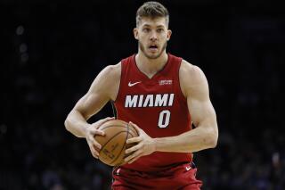 FILE - Miami Heat's Meyers Leonard plays during an NBA basketball game against the Philadelphia 76ers, Wednesday, Dec. 18, 2019, in Philadelphia. Meyers Leonard is getting another chance at the NBA, nearly two years after he used an anti-Semitic slur while playing a video game that was being livestreamed. A person with knowledge of the negotiations said Leonard and the Milwaukee Bucks have agreed on a 10-day contract, Monday, Feb. 20, 2023. (AP Photo/Matt Slocum, File)