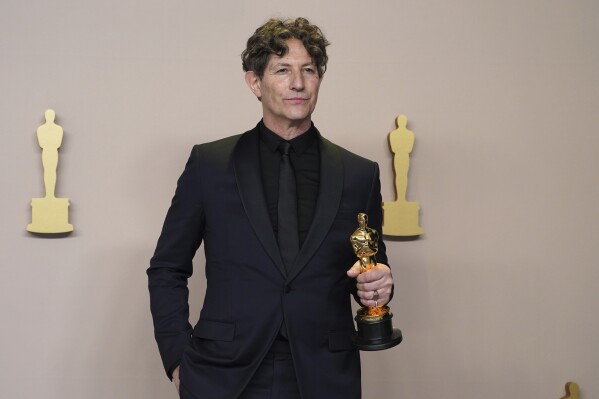 Jonathan Glazer poses with the award for best international feature film for "The Zone of Interest" from the United Kingdom in the press room at the Oscars on Sunday, March 10, 2024, at the Dolby Theatre in Los Angeles. (Photo by Jordan Strauss/Invision/AP)