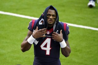 FILE - In this Jan. 3, 2021, file photo, Houston Texans quarterback Deshaun Watson walks off the field before the team's NFL football game against the Tennessee Titans in Houston. Watson, who is accused of sexual assault and harassment in lawsuits filed by 21 women, is being investigated by police after a report was filed regarding the NFL player, officials said Friday, April 2. In a tweet Friday, the Houston Police Department said a complainant had filed a report with the agency about Watson. (AP Photo/Eric Christian Smith, File)