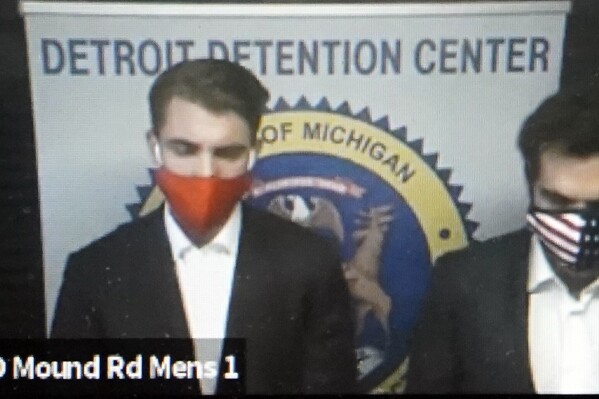 FILE - In this image taken from video provided by the 36th District Court in Michigan, Jacob Wohl, left, and Jack Burkman appear during their arraignment via video, Thursday, Oct. 8, 2020 in Detroit. Burkman and Wohl, two conservative political operatives who orchestrated a robocall campaign to dissuade Black people from voting in the 2020 election, have agreed to pay up to $1.25 million under a settlement with New York state, Attorney General Letitia James said Tuesday, April 9, 2024. (36th District Court via AP, File)