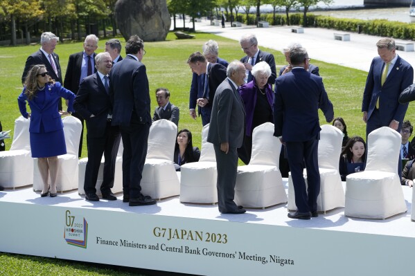 File - G7 finance ministers and central bank governors arrive for a group photo at their meeting in Niigata, Japan, on May 12, 2023. G7 finance ministers will gather in Stresa, Italy, May 24-25, 2024, in search of ways to squeeze more money for Ukraine out of Russian central bank assets frozen in Europe and the U.S. (AP Photo/Shuji Kajiyama, File)