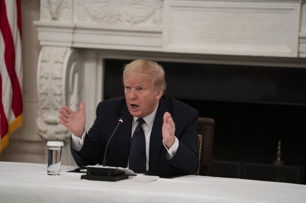 President Donald Trump speaks during a meeting with restaurant industry executives about the coronavirus response, in the State Dining Room of the White House, Monday, May 18, 2020, in Washington. (AP Photo/Evan Vucci)