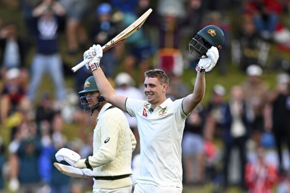 Australia's Cameron Green celebrates scoring 100 runs against New Zealand on the first day of their cricket test match in Wellington, New Zealand, Thursday, Feb. 29, 2024. (Kerry Marshall/Photosport via AP)