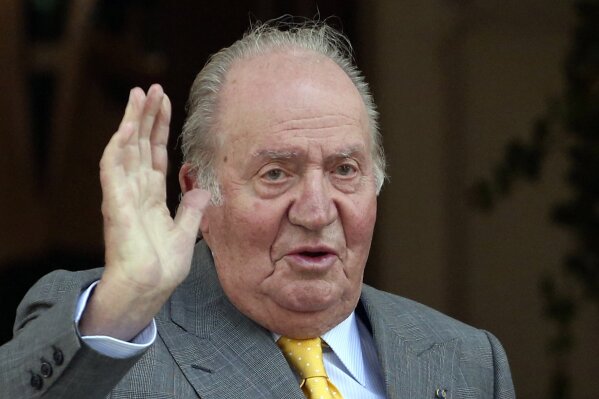FILE - In this March 10, 2018 file photo, Spain's former monarch King Juan Carlos waves upon his arrival to the Academia Diplomatica de Chile, in Santiago. The Spanish parliament's decision-making ...
