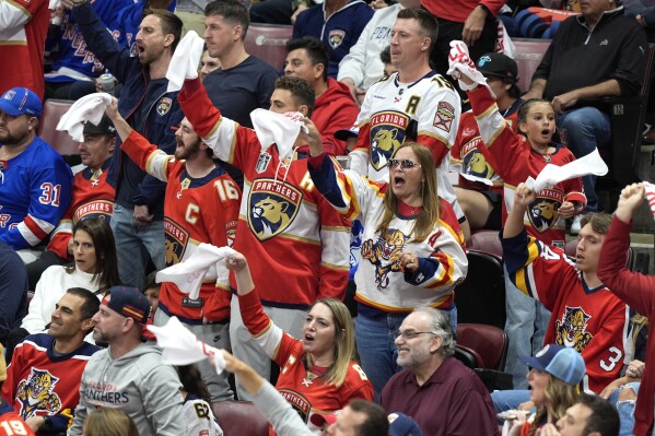 Florida Panthers fans cheer during the third period of Game 6 against the New York Rangers in the Eastern Conference finals of the NHL hockey Stanley Cup playoffs Saturday, June 1, 2024, in Sunrise, Fla. (AP Photo/Lynne Sladky)