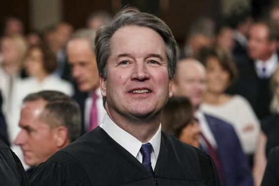 FILE - Supreme Court Associate Justice Brett Kavanaugh watches as President Donald Trump arrives to give his State of the Union address to a joint session on Congress at the Capitol in Washington, on Feb. 5, 2019. A new documentary looks into the sexual misconduct allegations against Kavanaugh and raises questions about the depth of the FBI investigation in 2018. “Justice,” from filmmaker Doug Liman, debuted Friday, Jan. 20, 2023, at the Sundance Film Festival to a sold-out theater surrounded by armed guards. (Doug Mills/The New York Times via AP, Pool, File)