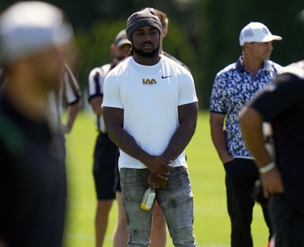 FILE - Dalvin Cook watches a New York Jets practice session at the NFL football team's training facility in Florham Park, N.J., July 30, 2023. A person with knowledge of the deal says the Jets agreed to terms on a one-year contract with former Minnesota Vikings running back Cook on Monday, Aug. 14, 2023, according to a person with knowledge of the deal. (AP Photo/Seth Wenig, File)