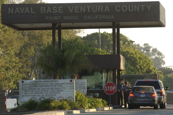 FILE - Cars enter Naval Base Ventura County, Aug. 25, 2005, in Ventura County, Calif. On Monday, Jan. 8, 2024, a U.S. Navy sailor based at California's Naval Base Ventura County was sentenced to just over two years in federal prison for transmitting sensitive U.S. military information to a Chinese intelligence officer. (Dave Getzschman/The Ventura County Star via AP, File)