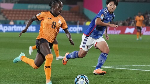 Zambia's Margaret Belemu attempts to run past Japan's Kiko Seike, right, during the Women's World Cup Group C soccer match between Zambia and Japan in Hamilton, New Zealand, Saturday, July 22, 2023. (AP Photo/John Cowpland)