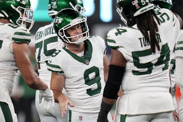 New York Jets place kicker Greg Zuerlein (9) celebrates with teammates after kicking a field goal against the Buffalo Bills during the fourth quarter of an NFL football game, Monday, Sept. 11, 2023, in East Rutherford, N.J. (AP Photo/Seth Wenig)