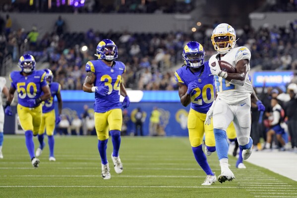 Los Angeles Chargers running back Elijah Dotson (42) scores a rushing touchdown during the fourth quarter of a preseason NFL football game against the Los Angeles Rams Saturday, Aug. 12, 2023, in Inglewood, Calif. (AP Photo/Mark J. Terrill)