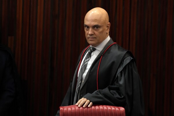FILE - Brazilian Supreme Court Chief Justice Alexandre de Moraes arrives for a court hearing in Brasilia, Brazil, June 22, 2023. (AP Photo/Eraldo Peres, File)