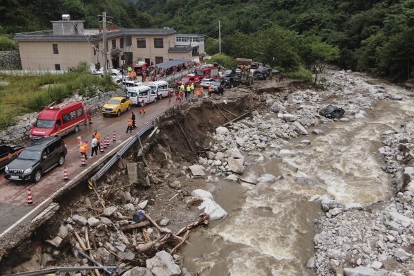 In this photo released by Xinhua News Agency, an aerial photo shows the aftermath of a mudslide in Weiziping village of Luanzhen township on the outskirts of Chang'an district, Xi'an of northwestern China's Shaanxi Province on Saturday Aug. 12, 2023. The mudslide caused by torrential rains killed multiple people on the outskirts of Xi'an in western China, an official news agency said Saturday, while some trains in the northeast were canceled as a powerful storm lashed the region. (Zou Jingyi/Xinhua via AP)
