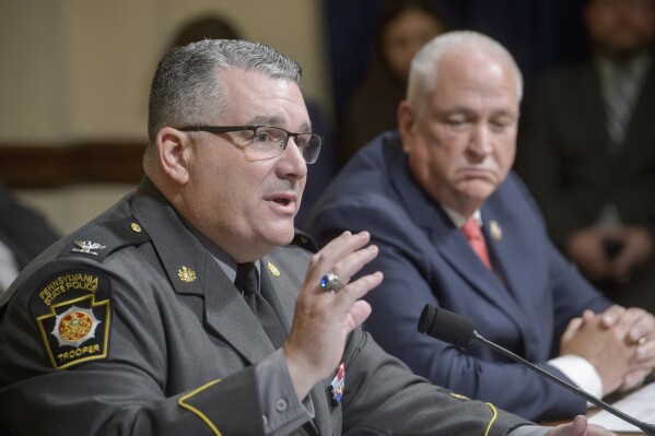Patrick Yoes, National President, Fraternal Order of Police, right, listens as Colonel Christopher L. Paris, Commissioner, Pennsylvania State Police, left, responds to questions during a House Committee on Homeland Security hearing examining the assassination attempt of July 13, on Capitol Hill, Tuesday, July 23, 2024, in Washington. (ĢӰԺ Photo/Rod Lamkey, Jr.)