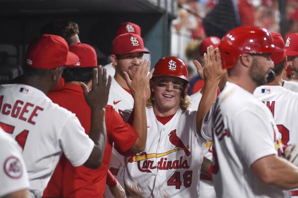 St. Louis Cardinals' Harrison Bader is congratulated after scoring a run during the sixth inning of the team's baseball game against the Minnesota Twins on Friday, July 30, 2021, in St. Louis. (AP Photo/Joe Puetz)