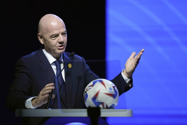 FILE - FIFA President Ganni Infantino addresses the 78th Conmebol Congress in Luque, Paraguay, Thursday, April 11, 2024. FIFA has been told to reschedule its inaugural expanded Club World Cup just over a year before the tournament is due to be hosted by America. (AP Photo/Jorge Saenz, File)