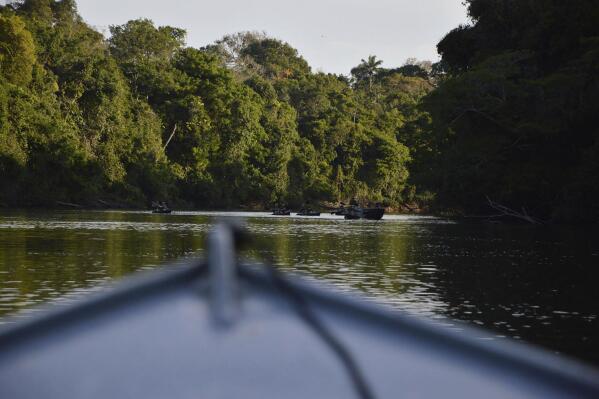 FILE - In this July 22, 2019, file photo provided by Rodrigo Vargas, a boat moves through Cristalino II State Park in the state of Mato Grosso, Brazil. There was an uproar in recent days after a state court invalidated the huge park. But the court backpedaled Monday, Aug. 8, 2022, and reopened the lawsuit. The judicial reversal is a setback for a cattle rancher dubbed the single worst destroyer of rainforest on record. (Rodrigo Vargas via AP, File)