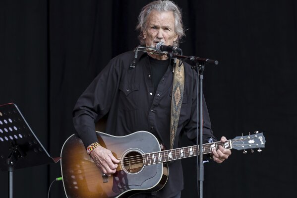 FILE - Singer Kris Kristofferson performs at the Glastonbury music festival at Worthy Farm, in Somerset, England, on June 23, 2017. Kristofferson has retired after five decades. A statement from his publicist said the Country Music Hall of Famer and Grammy winner retired in 2020. His son, John, stepped in last year to oversee his father's business including his record label. The Texas-born Oxford scholar brought introspective and poetic lyrics to country music with songs like “Sunday Mornin' Comin' Down” and “Me and Bobby McGee.” He was a member of the supergroup The Highwaymen and starred in 70 films over his career. (Photo by Grant Pollard/Invision/AP, File)