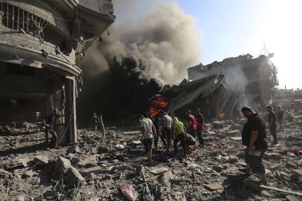 Palestinians inspect the damage of a house destroyed by an Israeli airstrike in Gaza City, Saturday, Nov. 4, 2023. (AP Photo/Abed Khaled)