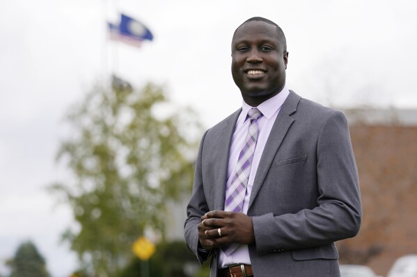 FILE - Mark Brave smiles as he poses outside the Strafford County Courthouse, Oct. 6, 2020, in Dover, N.H. Brave, the Strafford County, N.H., sheriff, has been arrested and charged with eight felonies as part an investigation into his misuse of county credit cards, the state attorney general announced Thursday, Aug. 17, 2023. (AP Photo/Charles Krupa, File)