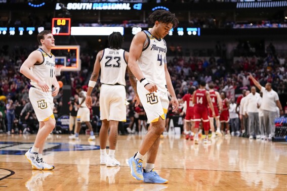 Marquette's Tyler Kolek (11), David Joplin (23) and Stevie Mitchell (4) react at the end of a Sweet 16 college basketball game against North Carolina State in the NCAA Tournament in Dallas, Friday, March 29, 2024. North Carolina State won 67-58. (AP Photo/Tony Gutierrez)
