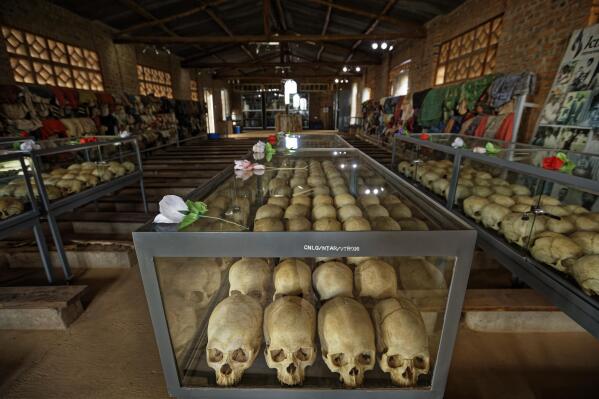FILE - Skulls of some of those who were slaughtered as they sought refuge in the church sit in glass cases, kept as a memorial to the thousands who were killed in and around the Catholic church during the 1994 genocide, in Ntarama, Rwanda, on April 5, 2019. A frail 87-year-old Rwandan, Félicien Kabuga, accused of encouraging and bankrolling the 1994 genocide in his home country goes on trial Thursday, Sept. 29, 2022, at a United Nations tribunal, nearly three decades after the 100-day massacre that left 800,000 dead. (AP Photo/Ben Curtis, File)