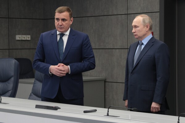 FILE - Russian President Vladimir Putin, right, stands next to Tula Region Governor Alexei Dyumin as he visits the Situational Center of the Tula Region Governor, in Tula, Russia, Friday, Dec. 23, 2022. Dyumin could be an establishment-supported candidate for Russian president if Vladimir Putin does not run for reelection or becomes incapacitated before the vote in March 2024. (Russian Presidential Press Office, Sputnik Pool Photo via AP, File)