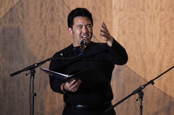 Kenzo Lee performs in "What Do I Do With All This Heritage?" on Wednesday, May 22, 2024, in Los Angeles. The show offers more than 14 true stories of Asian American Jews. (AP Photo/Ashley Landis)